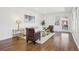 Inviting living room featuring hardwood floors, ample natural light, and comfortable seating area at 335 Amberidge Trl, Atlanta, GA 30328