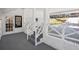 Covered porch with white brick and railings, offering a view of the front yard at 335 Amberidge Trl, Atlanta, GA 30328