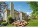Two-story home with a large wooden deck, perfect for outdoor dining and entertaining at 431 Shore Dr, Suwanee, GA 30024