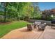 Wooden deck featuring outdoor seating around a fire pit, ideal for relaxation and entertaining at 431 Shore Dr, Suwanee, GA 30024
