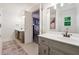 Bright bathroom with a double vanity, modern fixtures, and a view into the bedroom at 431 Shore Dr, Suwanee, GA 30024