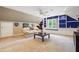 Bonus room with a fan, blue shelving, large windows and a comfy couch at 431 Shore Dr, Suwanee, GA 30024