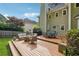 A spacious wooden deck featuring a seating area and dining set in a well-maintained backyard at 431 Shore Dr, Suwanee, GA 30024