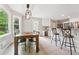Spacious kitchen with modern lighting, breakfast bar, and an adjacent dining area at 431 Shore Dr, Suwanee, GA 30024