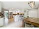Open kitchen with breakfast bar, stainless appliances, and eat-in area with outdoor view at 431 Shore Dr, Suwanee, GA 30024