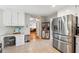 Well-lit kitchen featuring stainless steel appliances, ample counter space, and eat-in breakfast area at 431 Shore Dr, Suwanee, GA 30024