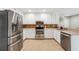 Stylish kitchen with stainless steel appliances, ample counter space, and white cabinetry at 431 Shore Dr, Suwanee, GA 30024