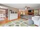 Cozy open-concept room with hardwood floors, fireplace, and ample seating area at 431 Shore Dr, Suwanee, GA 30024
