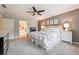 Cozy main bedroom with neutral decor, plush carpet, and ample natural light at 431 Shore Dr, Suwanee, GA 30024