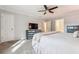 Bright main bedroom with neutral walls, plush carpet, and double-door access to en-suite at 431 Shore Dr, Suwanee, GA 30024