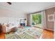 Bright playroom with a large window, play rug, and stylish decor accents at 431 Shore Dr, Suwanee, GA 30024
