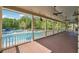 View of a large community pool area from the covered patio, offering a luxurious outdoor experience at 431 Shore Dr, Suwanee, GA 30024
