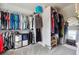 Spacious walk-in closet with ample storage and custom shelving at 431 Shore Dr, Suwanee, GA 30024