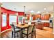 Dining area with a wood table and a kitchen in the background at 5447 Stirrup Way, Powder Springs, GA 30127