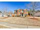 Inviting two-story brick house with well-kept lawn and traditional architectural details at 5447 Stirrup Way, Powder Springs, GA 30127