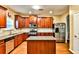 A cozy kitchen featuring a granite countertop island and stainless steel appliances at 5447 Stirrup Way, Powder Springs, GA 30127