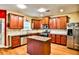 A cozy kitchen featuring a granite countertop island and stainless steel appliances at 5447 Stirrup Way, Powder Springs, GA 30127