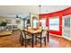Spacious open-concept living room and dining area with wood floors at 5447 Stirrup Way, Powder Springs, GA 30127
