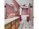 Bathroom with double sink vanity, bath tub, and decorated wallpaper with floral accents at 865 Turner Dr, Lawrenceville, GA 30046