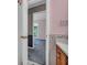 Bathroom features vintage wallpaper, wood cabinets, and view into the bedroom at 865 Turner Dr, Lawrenceville, GA 30046
