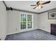 A bright bedroom with a large window to let light in and soft carpet at 865 Turner Dr, Lawrenceville, GA 30046