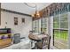 Bright breakfast nook with windows overlooking backyard views and table set for two at 865 Turner Dr, Lawrenceville, GA 30046