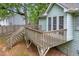 View of the backyard wooden deck with access to the backyard at 865 Turner Dr, Lawrenceville, GA 30046