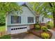 Charming two-story home with light blue siding, blue shutters, and an attached garage at 865 Turner Dr, Lawrenceville, GA 30046