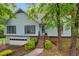 Two-story home with attached garage, landscaping, and walkway at 865 Turner Dr, Lawrenceville, GA 30046