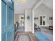 Inviting foyer with hardwood floors, wallpaper, and views into living spaces at 865 Turner Dr, Lawrenceville, GA 30046