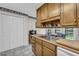 Kitchen sink featuring wood cabinets and stainless steel sink with a view to the backyard at 865 Turner Dr, Lawrenceville, GA 30046