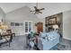 Open living room with tall ceilings, fireplace, and a decorative ceiling fan at 865 Turner Dr, Lawrenceville, GA 30046