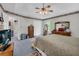 Main bedroom with soft carpet, an ensuite, and ample natural light from large windows at 865 Turner Dr, Lawrenceville, GA 30046