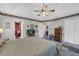 Spacious main bedroom with a tray ceiling, carpet, and ensuite access at 865 Turner Dr, Lawrenceville, GA 30046