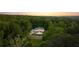 Stunning aerial view of a secluded home surrounded by lush greenery and beautiful landscaping at 5260 Long Island Nw Dr, Atlanta, GA 30327