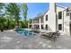 A spacious backyard features a pool, lounge seating, and screened-in patio at 5260 Long Island Nw Dr, Atlanta, GA 30327