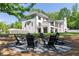 A lovely backyard area with a fire pit and Adirondack chairs is perfect for entertaining at 5260 Long Island Nw Dr, Atlanta, GA 30327
