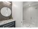 Bathroom with glass door shower, marble countertop, and modern fixtures at 5260 Long Island Nw Dr, Atlanta, GA 30327