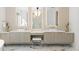 Spa-like bathroom featuring dual vanities, elegant lighting, and high-end finishes for ultimate relaxation at 5260 Long Island Nw Dr, Atlanta, GA 30327