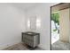 A modern bathroom features a vanity with a sleek countertop and floating cabinet at 5260 Long Island Nw Dr, Atlanta, GA 30327
