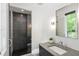 Contemporary bathroom showcasing a glass-enclosed shower and a sleek vanity at 5260 Long Island Nw Dr, Atlanta, GA 30327