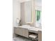 Bathroom vanity area with white countertop, sleek cabinets, and lighted mirror, offering a serene space at 5260 Long Island Nw Dr, Atlanta, GA 30327