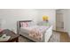 Bright bedroom featuring a comfortable bed, stylish decor, and an open door to an adjoined closet at 5260 Long Island Nw Dr, Atlanta, GA 30327