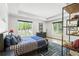 Bright bedroom with large windows, tray ceiling, and stylish decor at 5260 Long Island Nw Dr, Atlanta, GA 30327