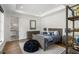 Bedroom with a neutral pallet, dark furniture, and dark wood floors at 5260 Long Island Nw Dr, Atlanta, GA 30327