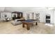 Luxurious game room with a pool table, arcade machine, and built-in bar area at 5260 Long Island Nw Dr, Atlanta, GA 30327