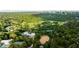 Aerial view of the community golf course, riding arena, and other amenities, surrounded by lush green trees at 5260 Long Island Nw Dr, Atlanta, GA 30327