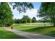 Scenic golf course view with lush green fairway and mature trees, perfect for outdoor recreation and enjoying nature at 5260 Long Island Nw Dr, Atlanta, GA 30327