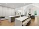 Open-concept kitchen with double islands, vaulted ceiling, hardwood floors, and stainless appliances at 5260 Long Island Nw Dr, Atlanta, GA 30327