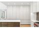 Custom kitchen features modern cabinets, a large island and hardwood floors at 5260 Long Island Nw Dr, Atlanta, GA 30327